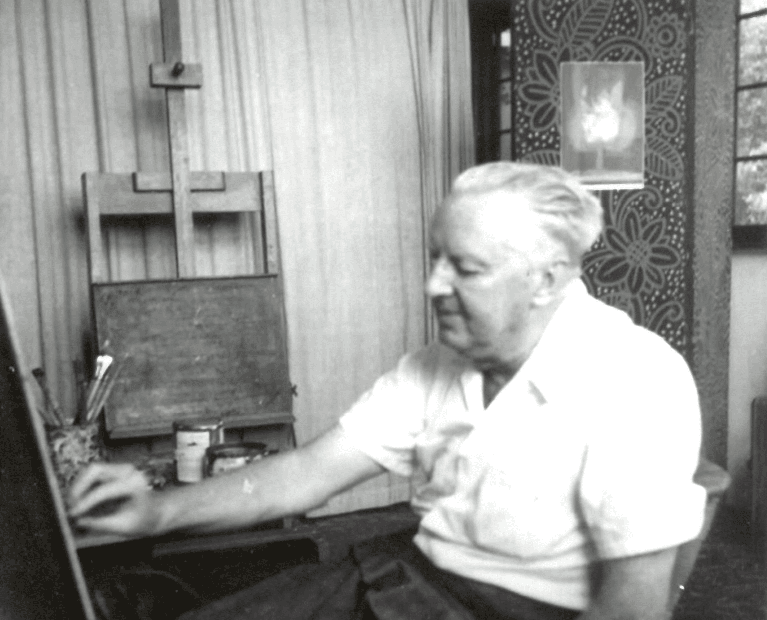 A&H Founder Andre Smith sitting in his art studio working.